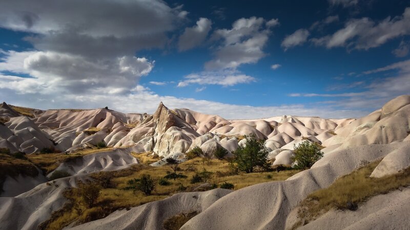 Rock Formations in Valley — Blue, Dramatic, Afternoon, Photograph