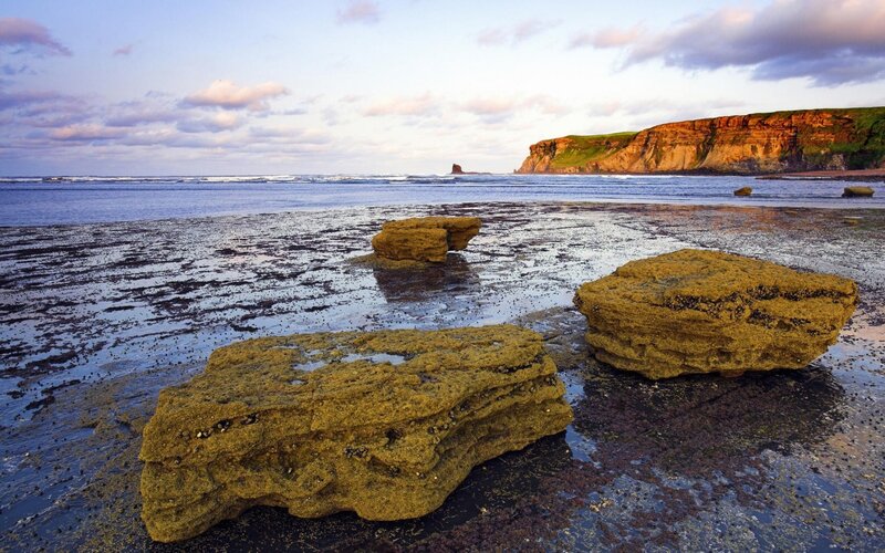 Rock Formations on Beach — Blue, Serene, Sunset, Photograph, Ocean, Cliffs
