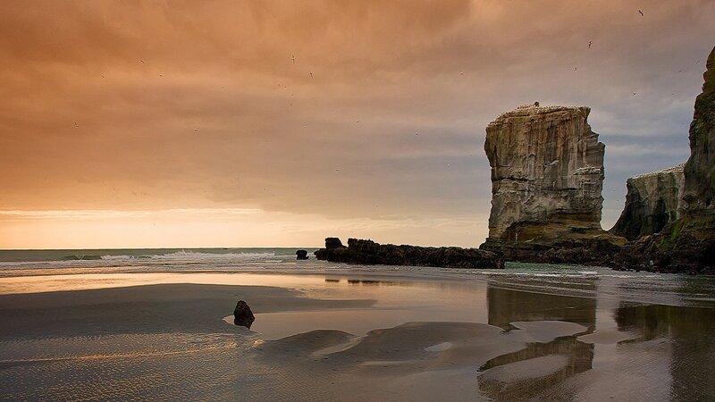 Rock Formations on Beach — Orange, Dramatic, Sunset, Photograph, Ocean, Birds