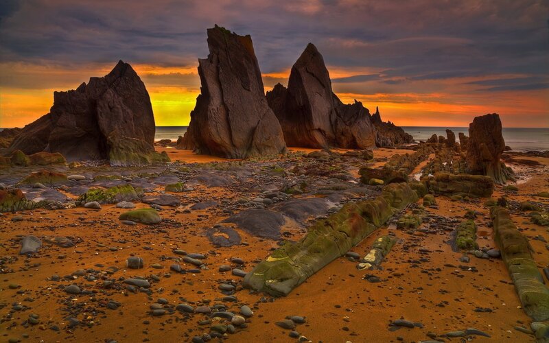 Rock Formations on Beach — Orange, Dramatic, Sunset, Photograph, Rocks