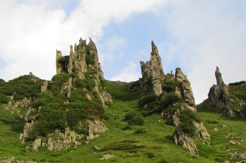 Rock Formations on Hillside — Green