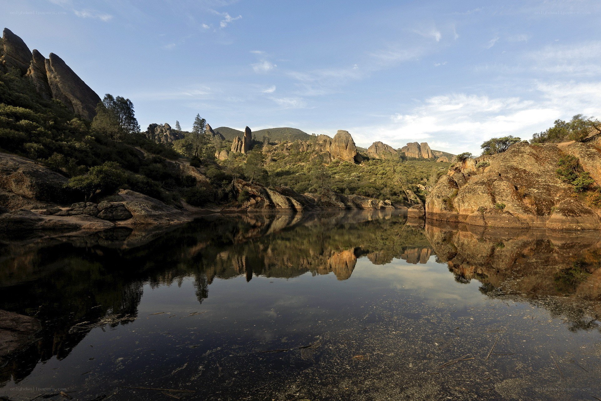 Rock formations reflected in calm water