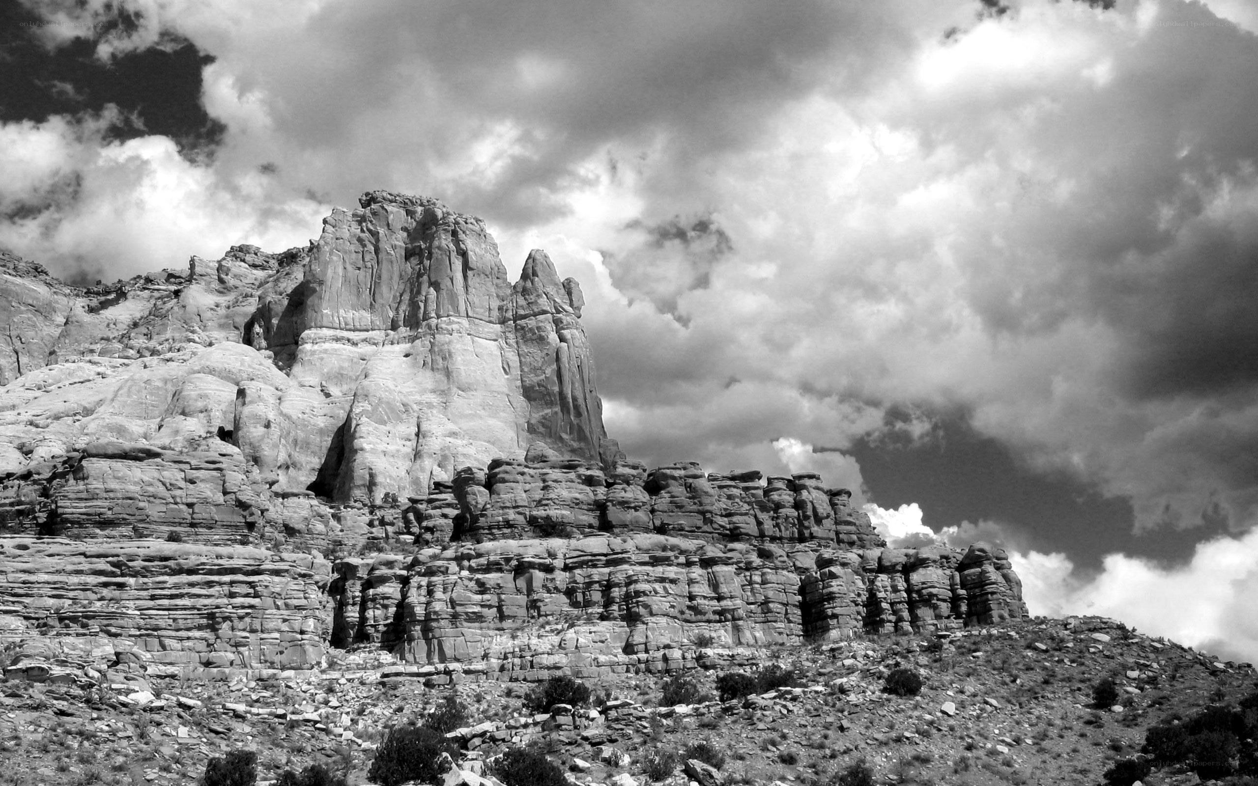 rock formations under cloudy sky