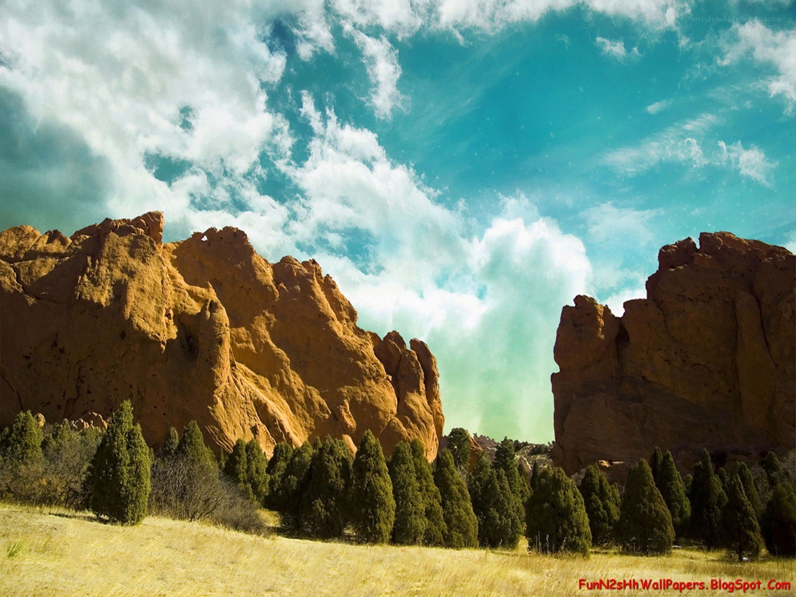 rock formations under cloudy sky