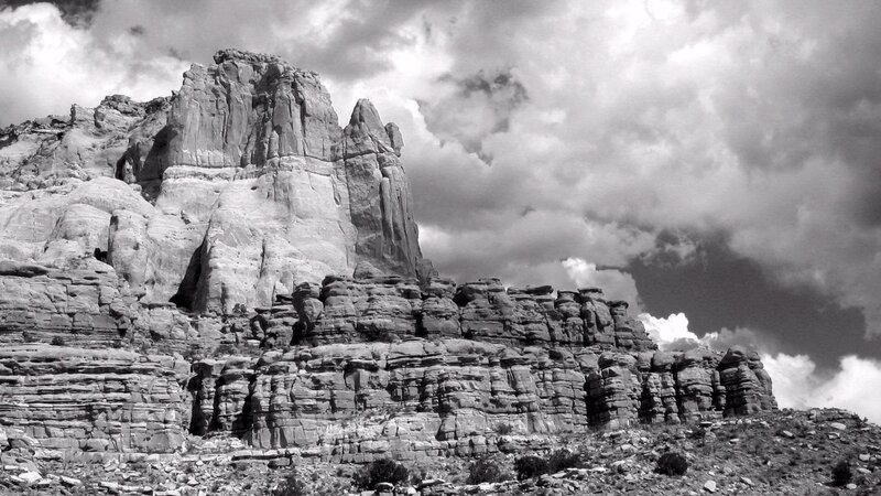 rock formations under cloudy sky