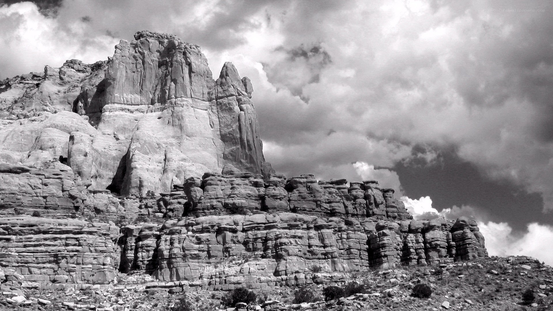 rock formations under cloudy sky