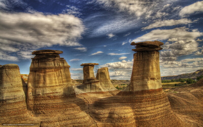 Rock formations under cloudy sky