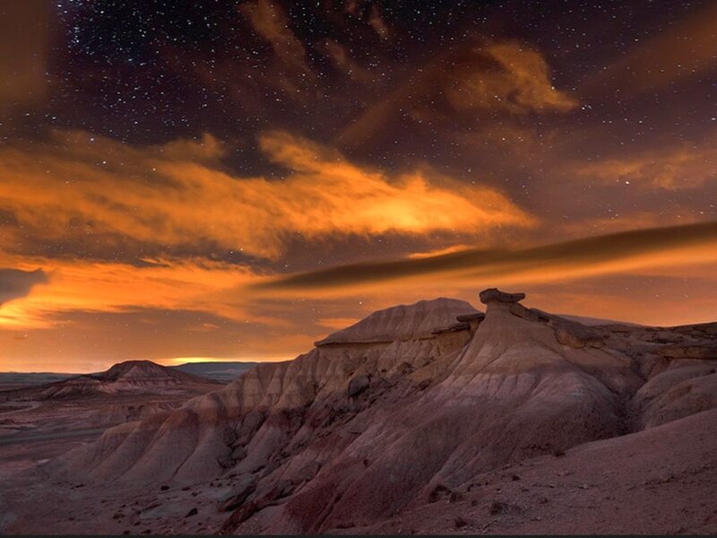 Rock Formations under Stars — Orange, Dramatic
