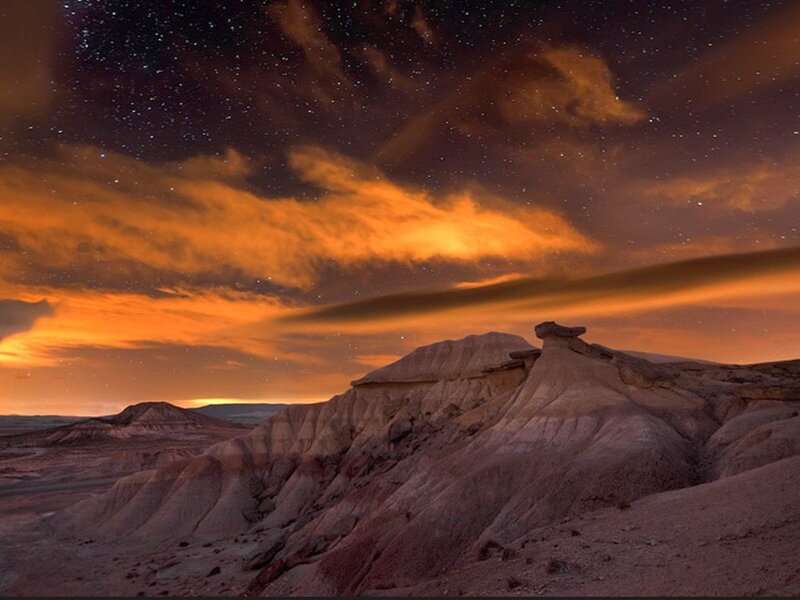 Rock Formations under Stars — Orange