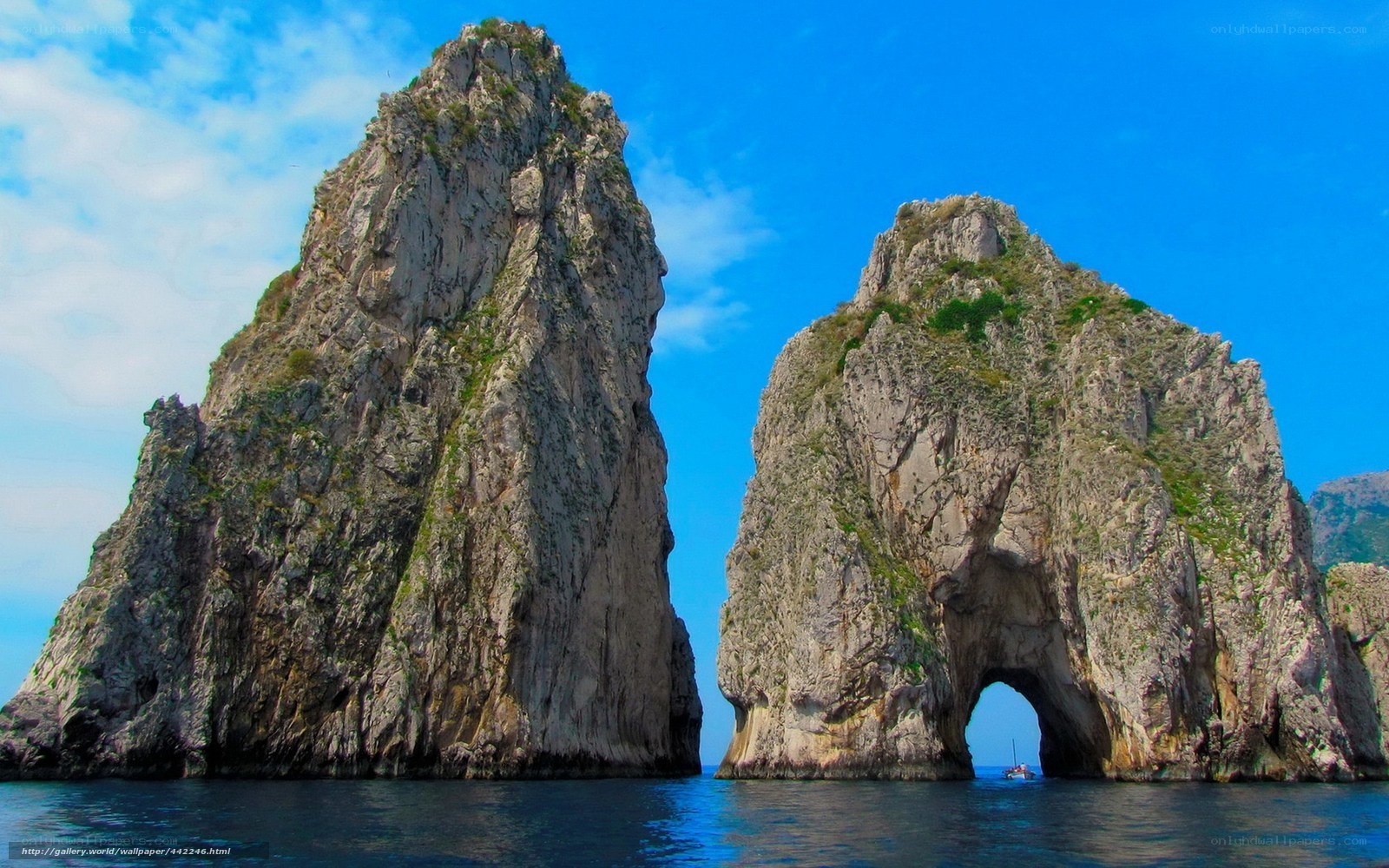 Rock formations with arch in sea