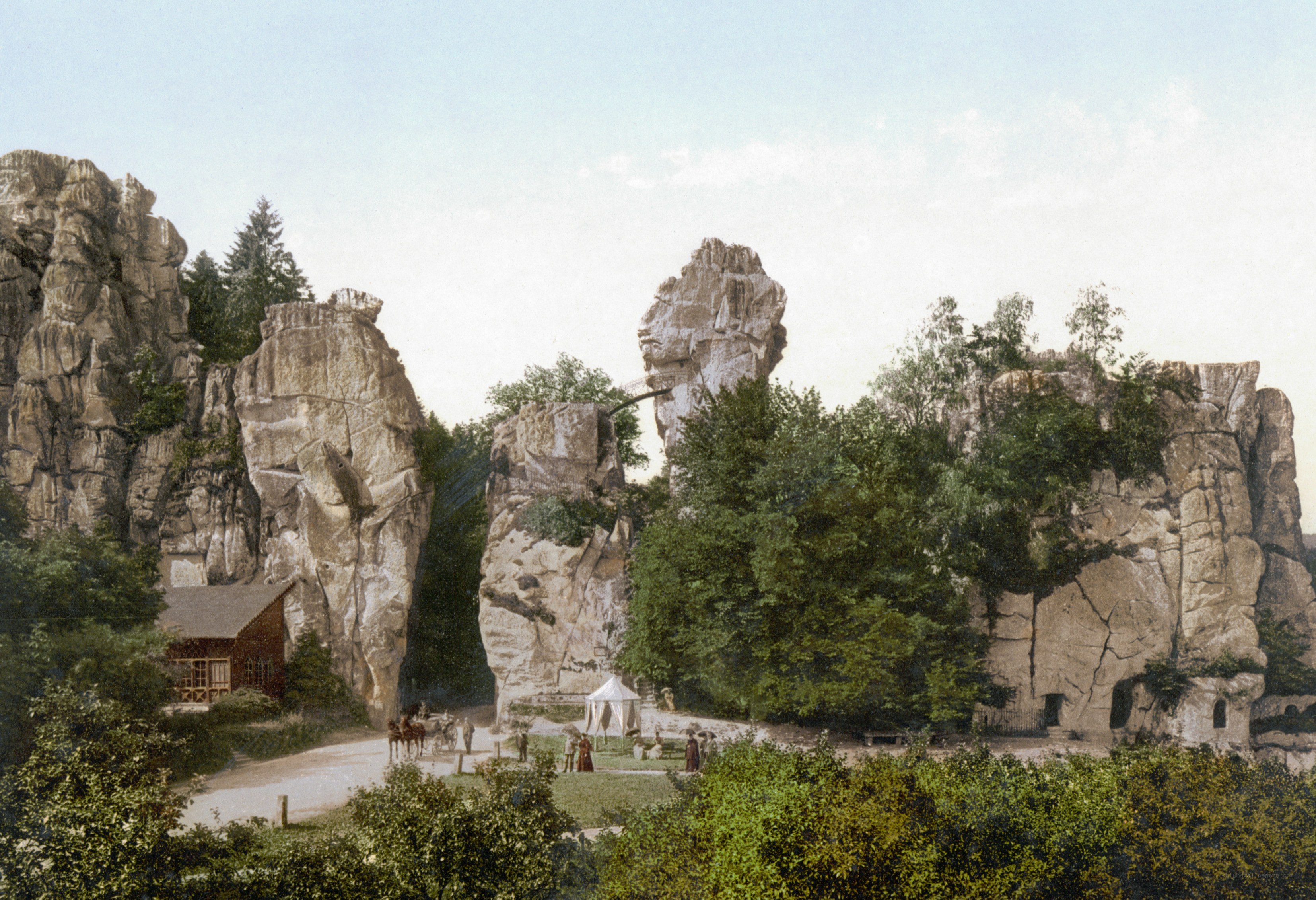 Rock formations with people and tent