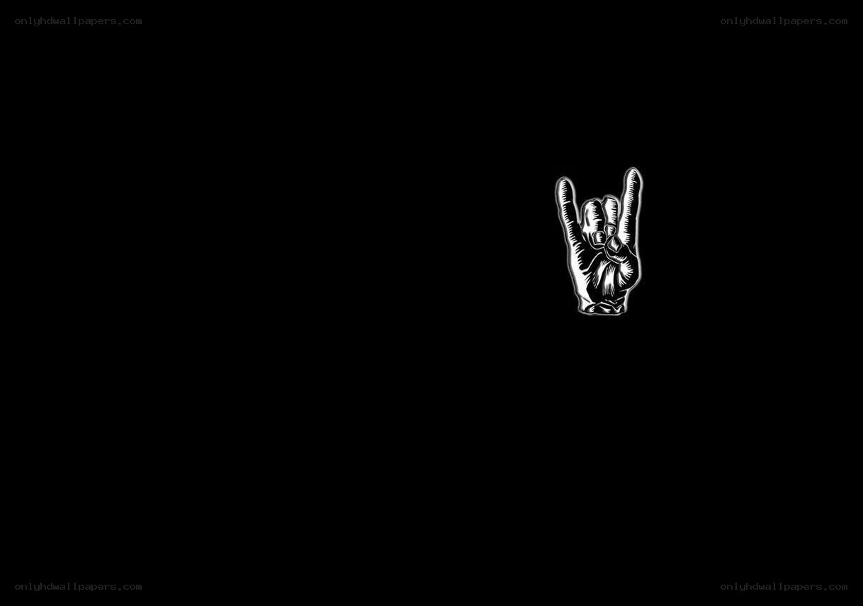 rock hand gesture on black