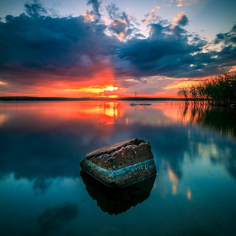Rock in Calm Lake — Blue, Dramatic
