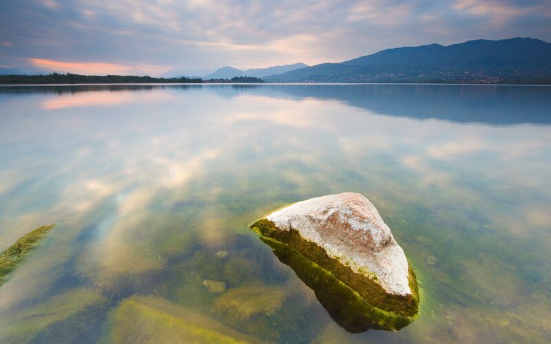 Rock in Calm Lake — Blue, Serene, Sunset, Photograph, Mountains, Sky