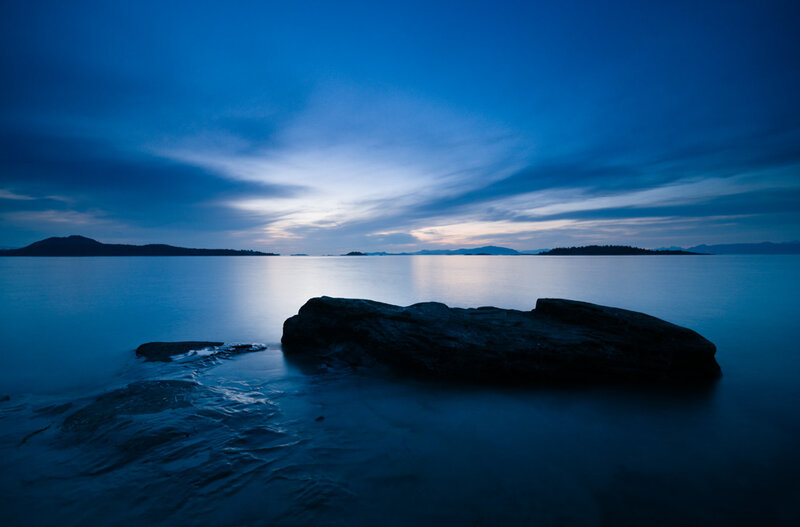 Rock in Calm Water — Blue, Serene, Night