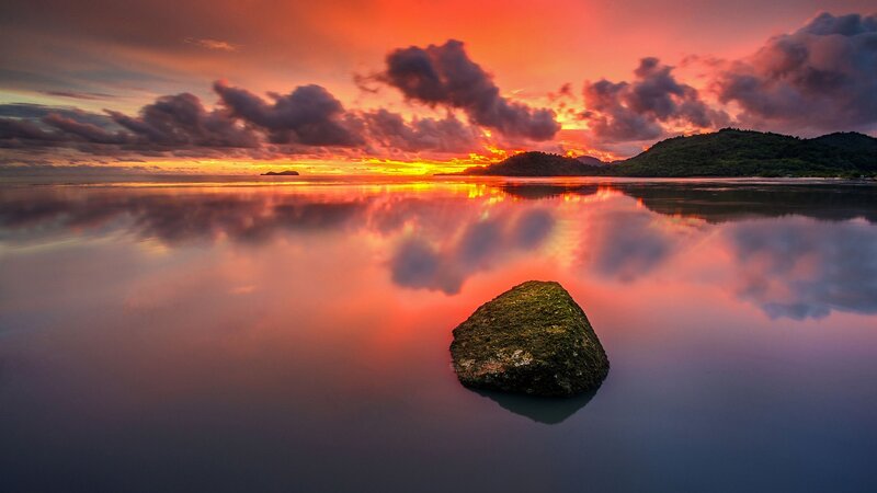 Rock in Calm Water — Orange, Serene, Sunset
