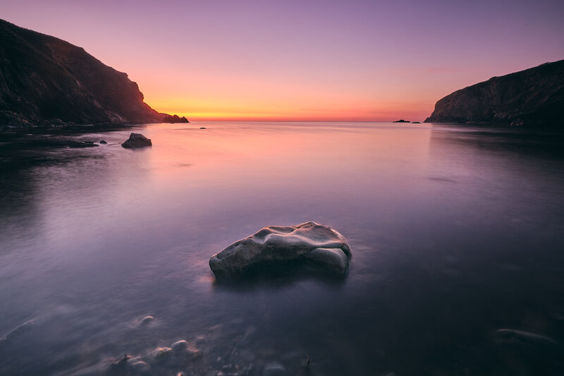 Rock in Calm Water — Purple, Serene, Sunset, Photograph