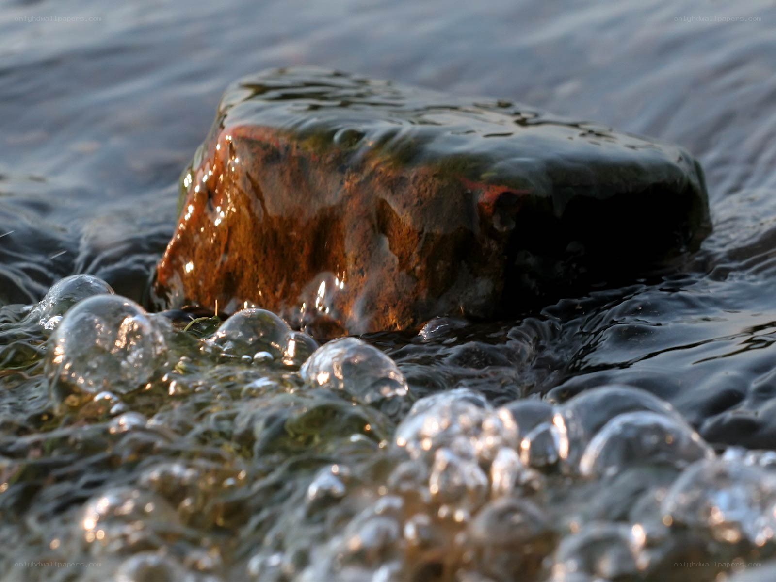 Rock in flowing water