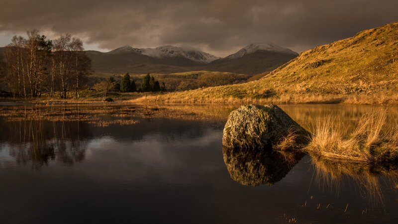 Rock in Lake with Mountains