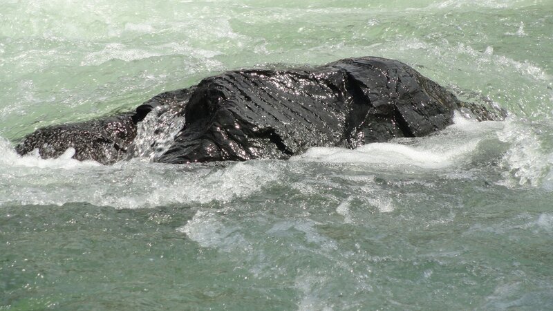 rock in rushing river