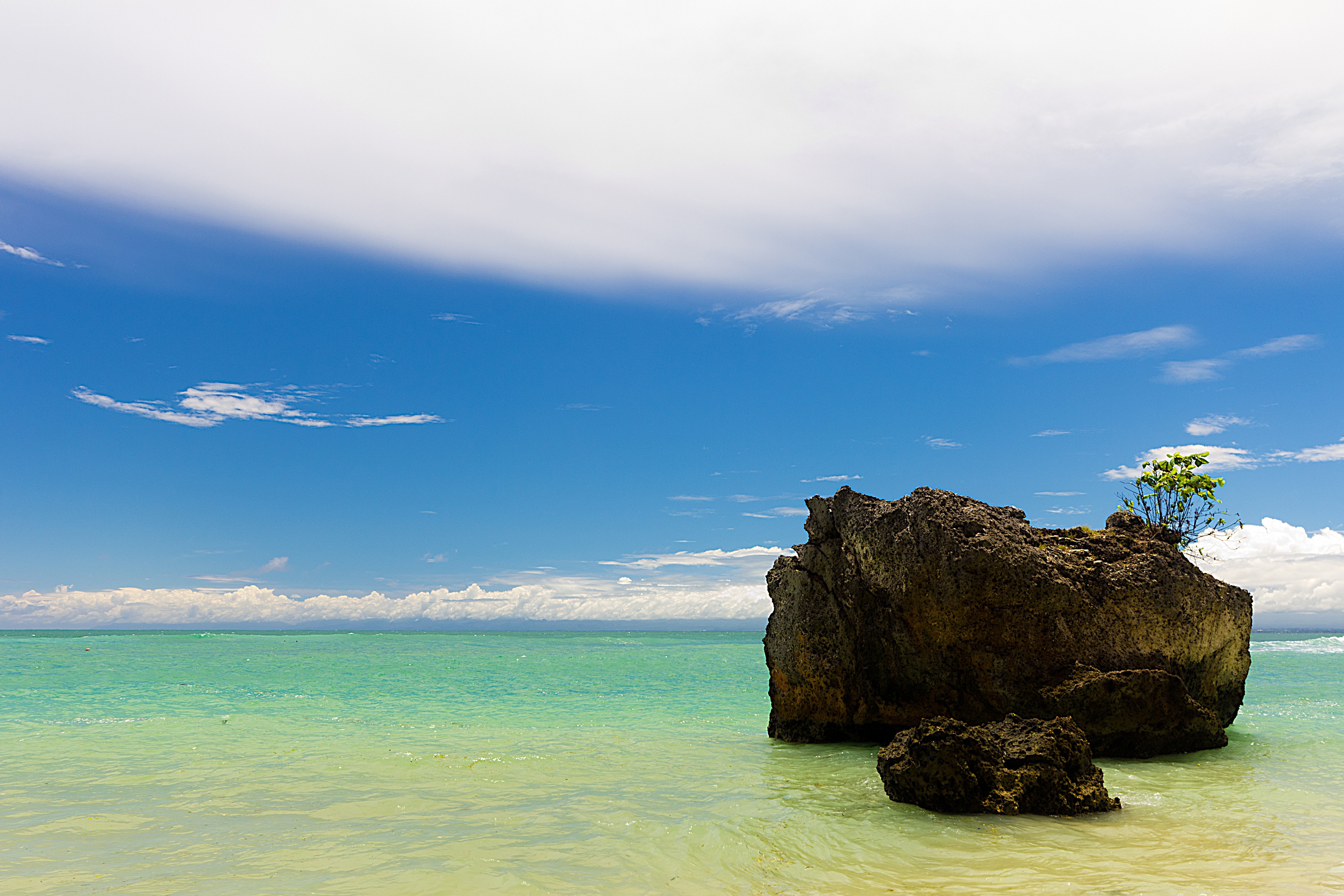 Rock in turquoise water