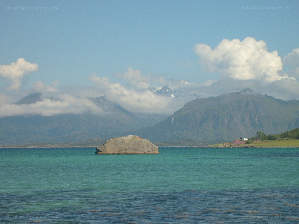 Rock in turquoise water