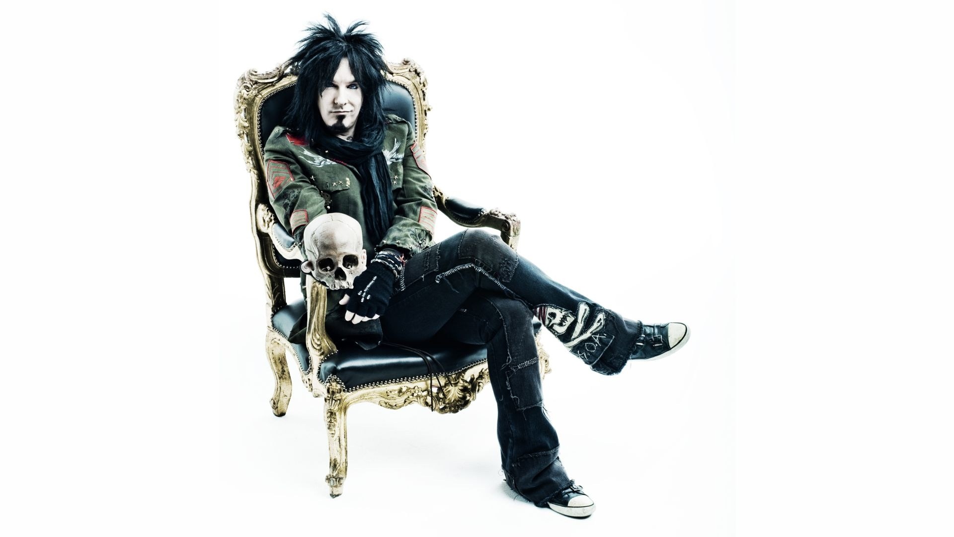 rock musician on ornate chair