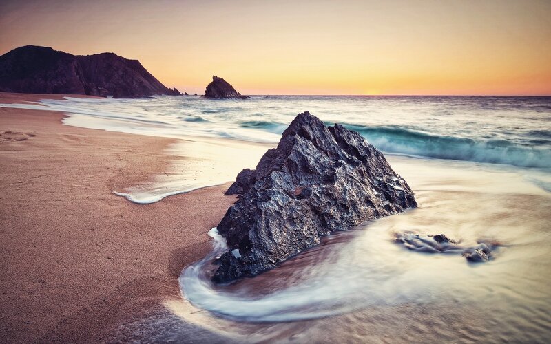 Rock on Beach at Sunset — Serene