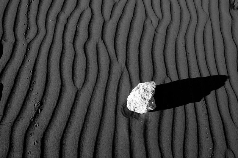 Rock on rippled sand