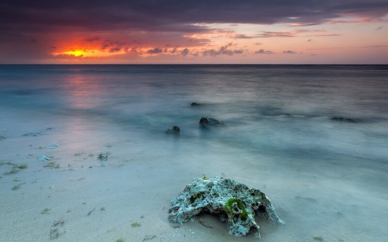 Rock on Sandy Beach — Orange, Serene, Sunset