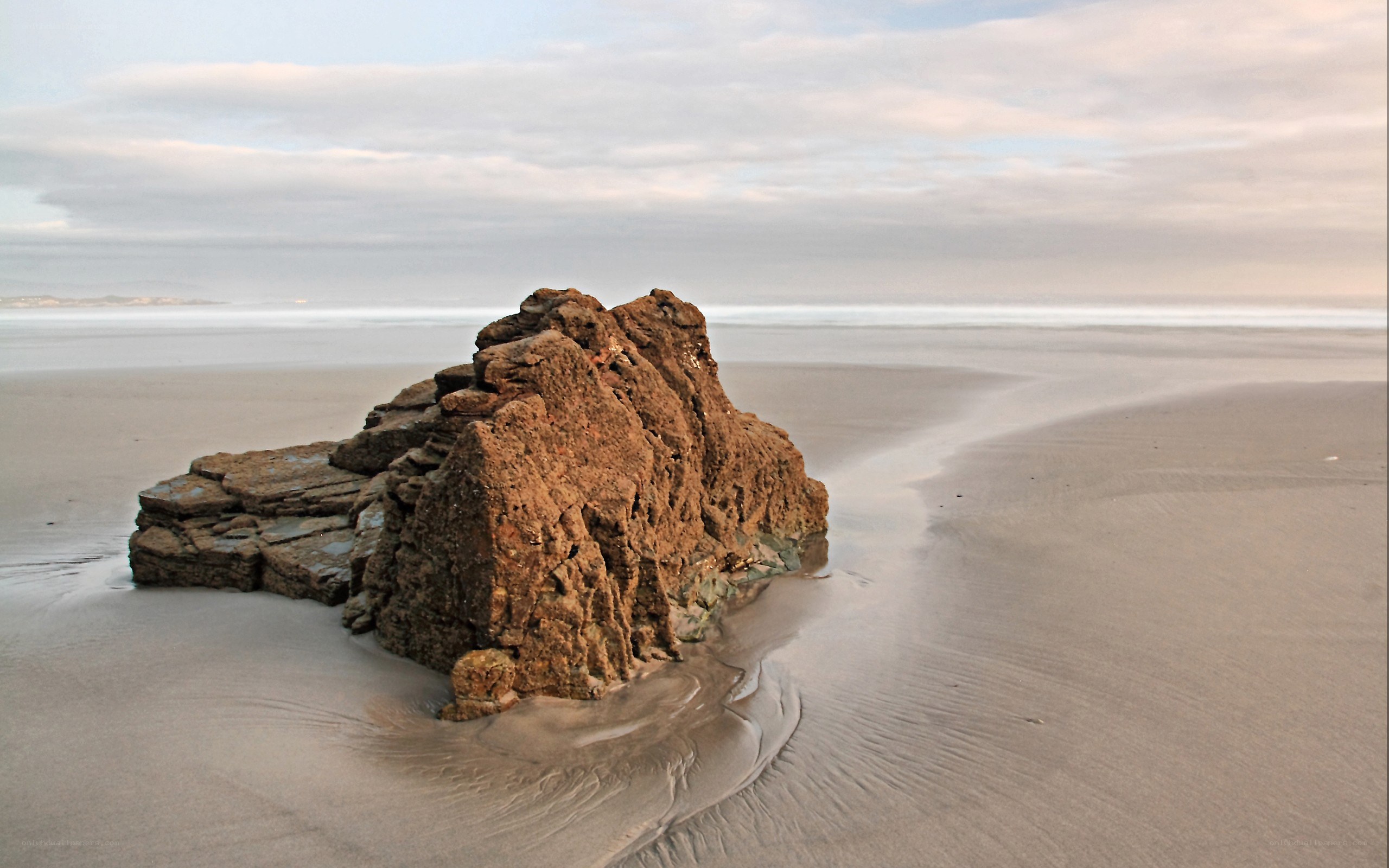 Rock on the beach at low tide