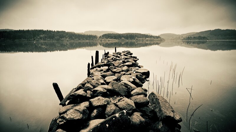 Rock Pier on Lake — Gray