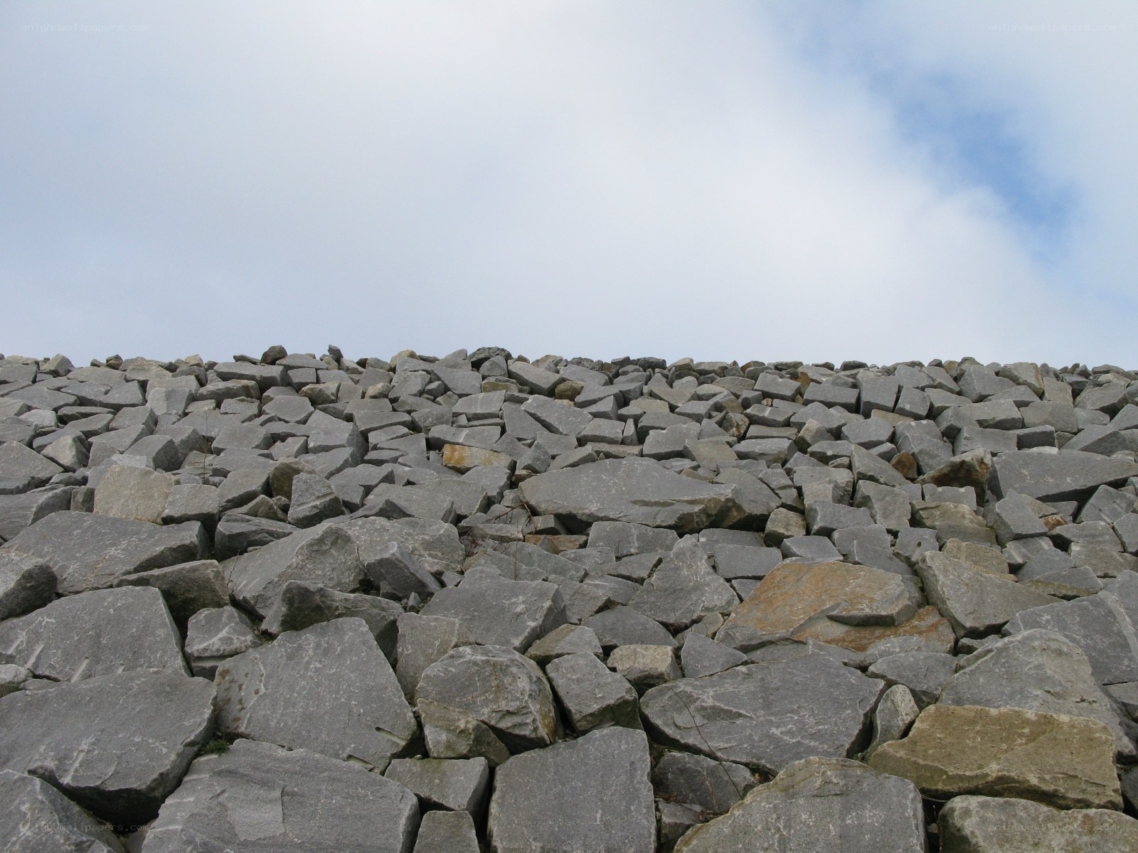 rock pile under cloudy sky