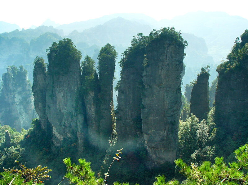 Rock Pillars in Forest — Green, Serene, Morning, Photograph, Trees, Mountains