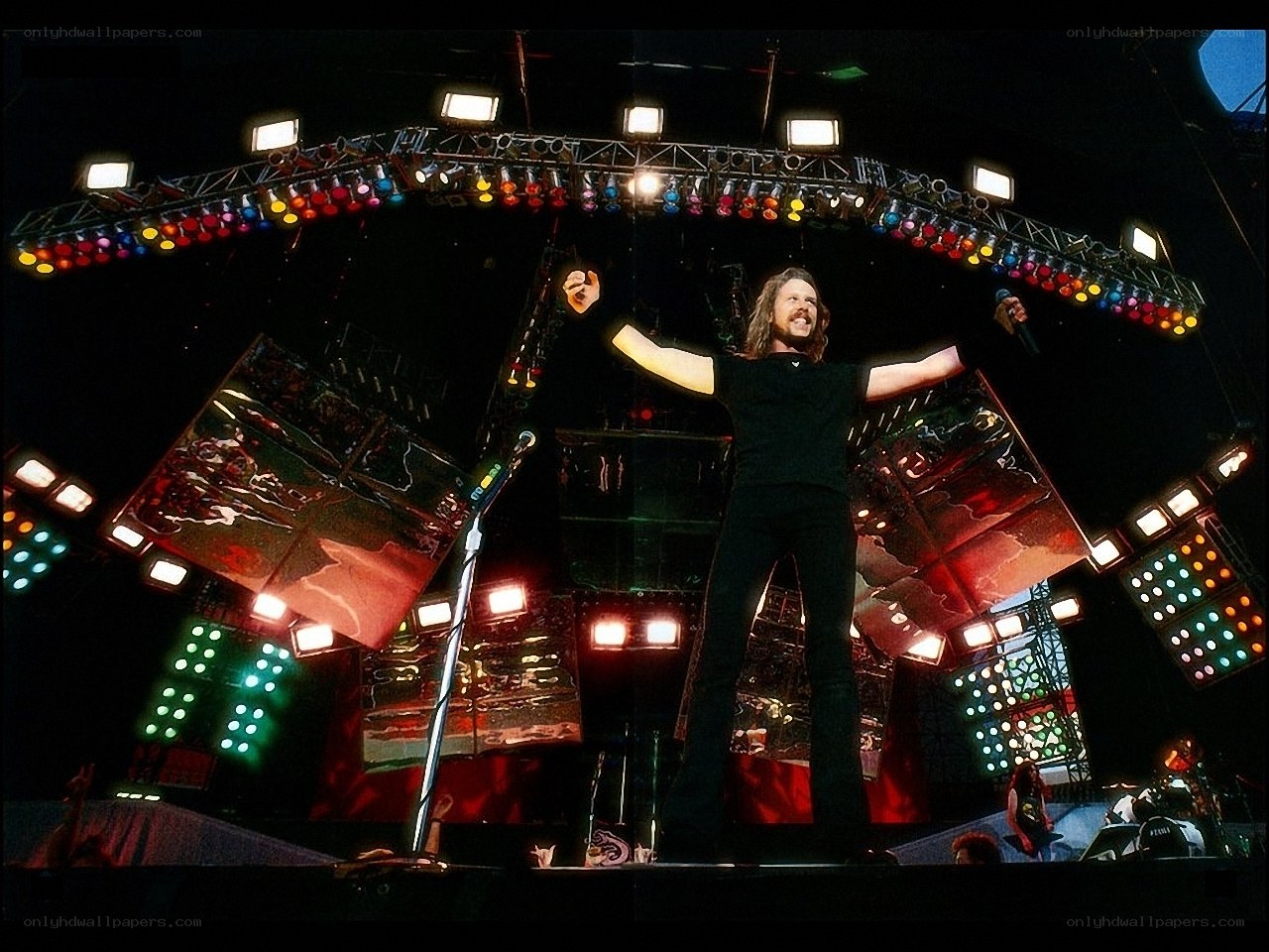 Rock singer on stage with lights