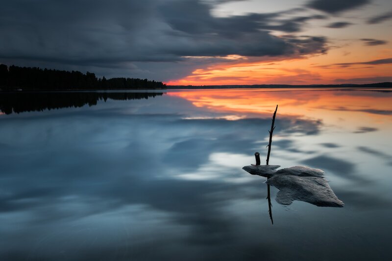 Rock with Stick in Lake