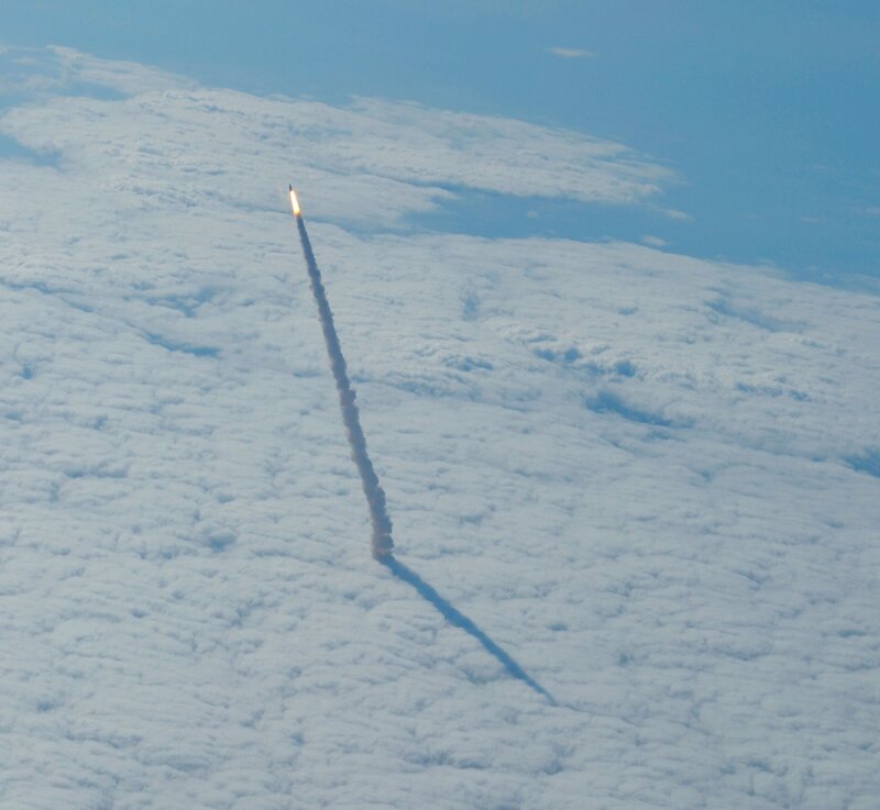 rocket launch above clouds