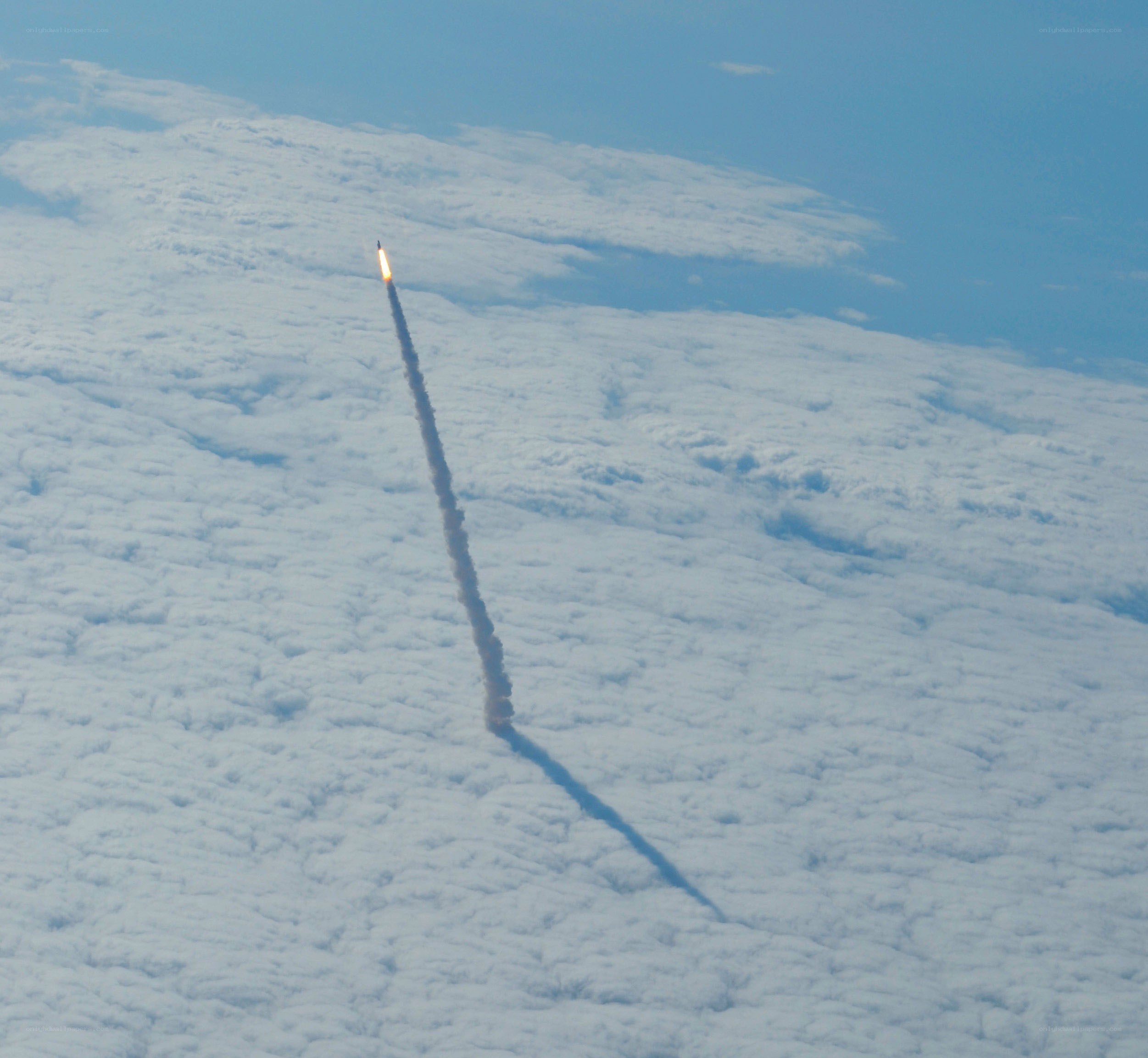rocket launch above clouds