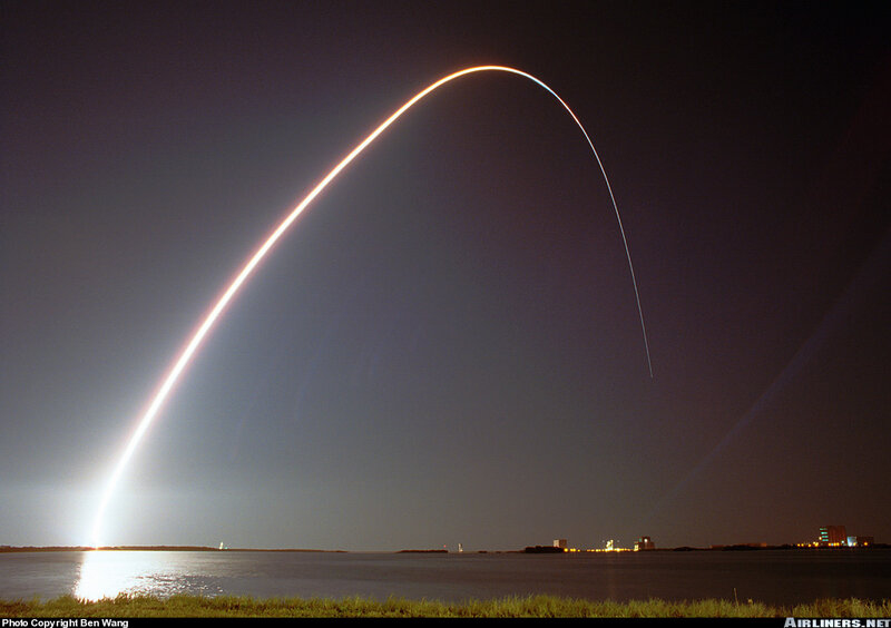 Rocket launch arc over water