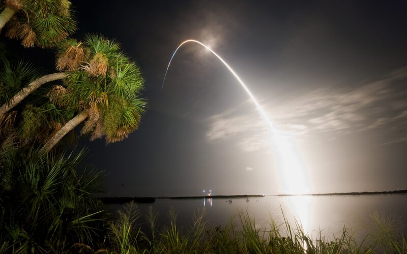 Rocket Launch at Night — Black, Dramatic, Photograph, Palm Trees, Water, Sky, Light Trail
