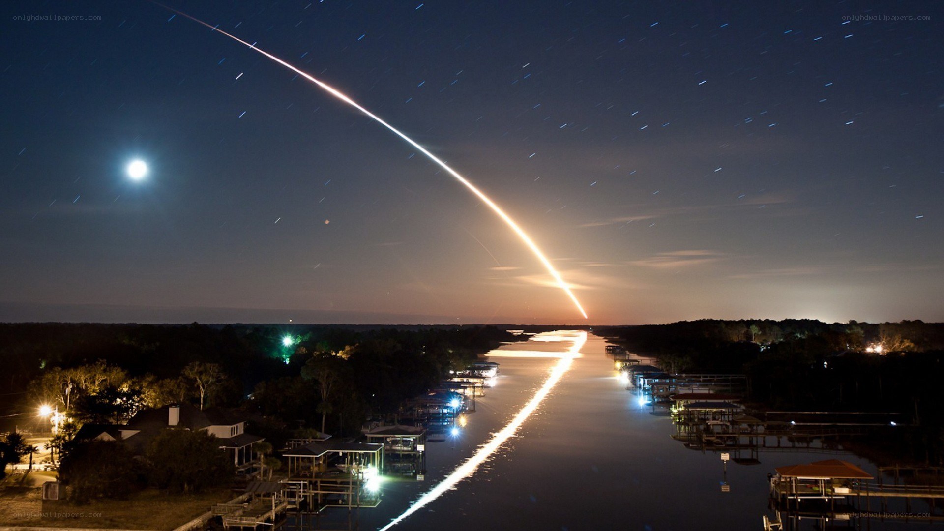 Rocket launch over canal at night