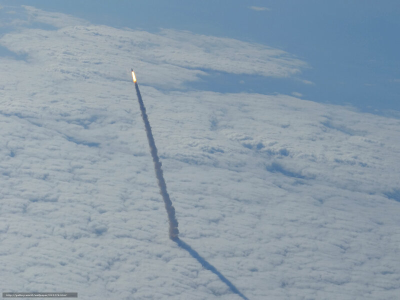 Rocket launch over clouds