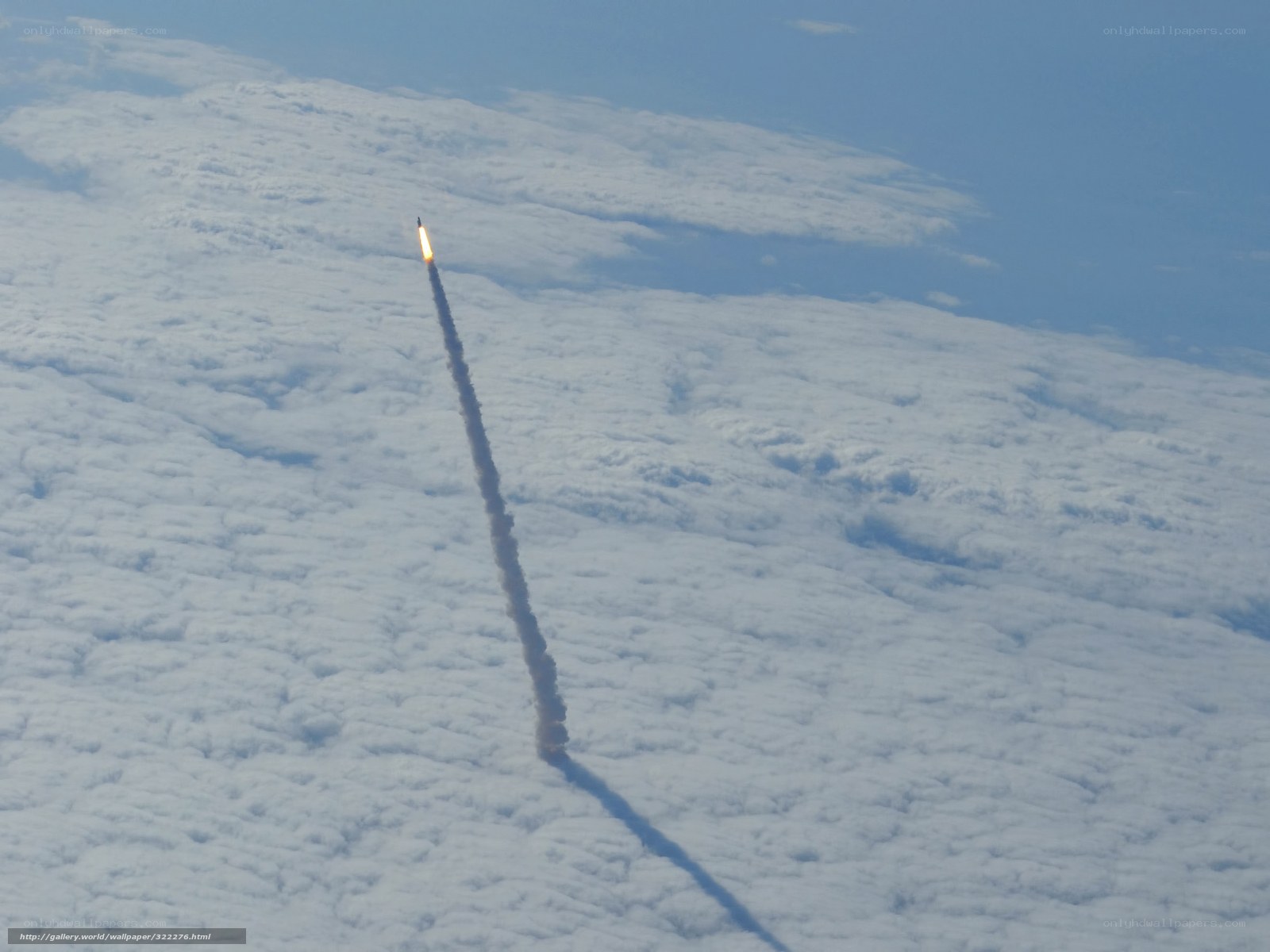 Rocket launch over clouds