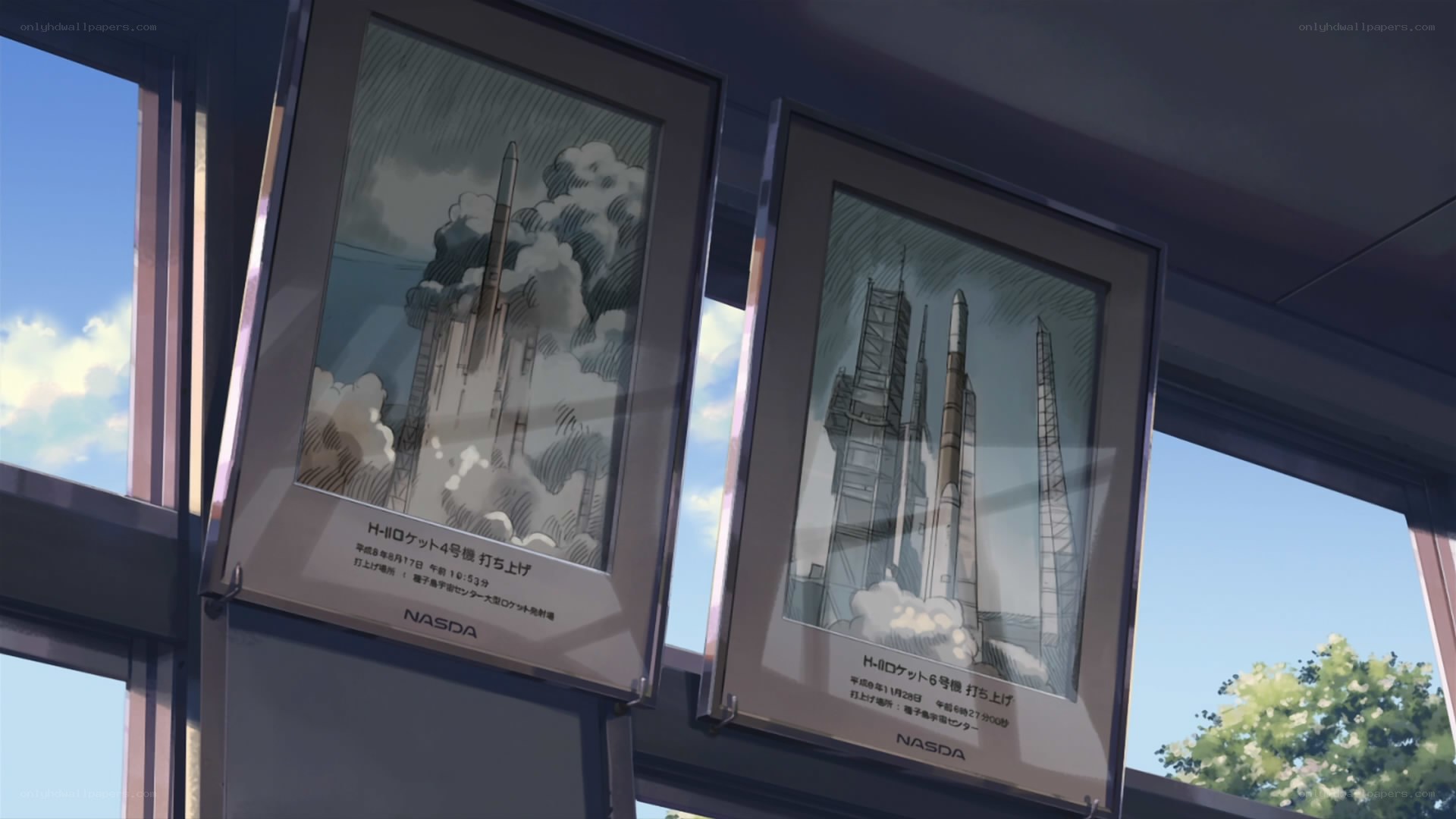 Rocket launch posters in a window