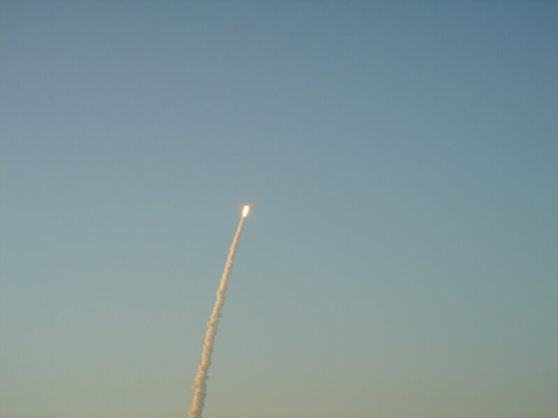 Rocket Launching into Sky — Blue, Dramatic
