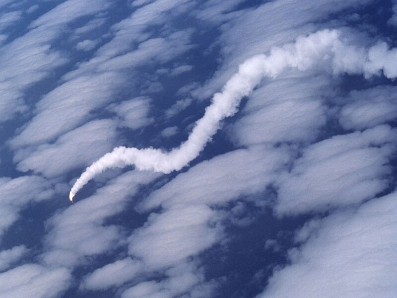 Rocket Launching Through Clouds — Blue, Dramatic, Photograph