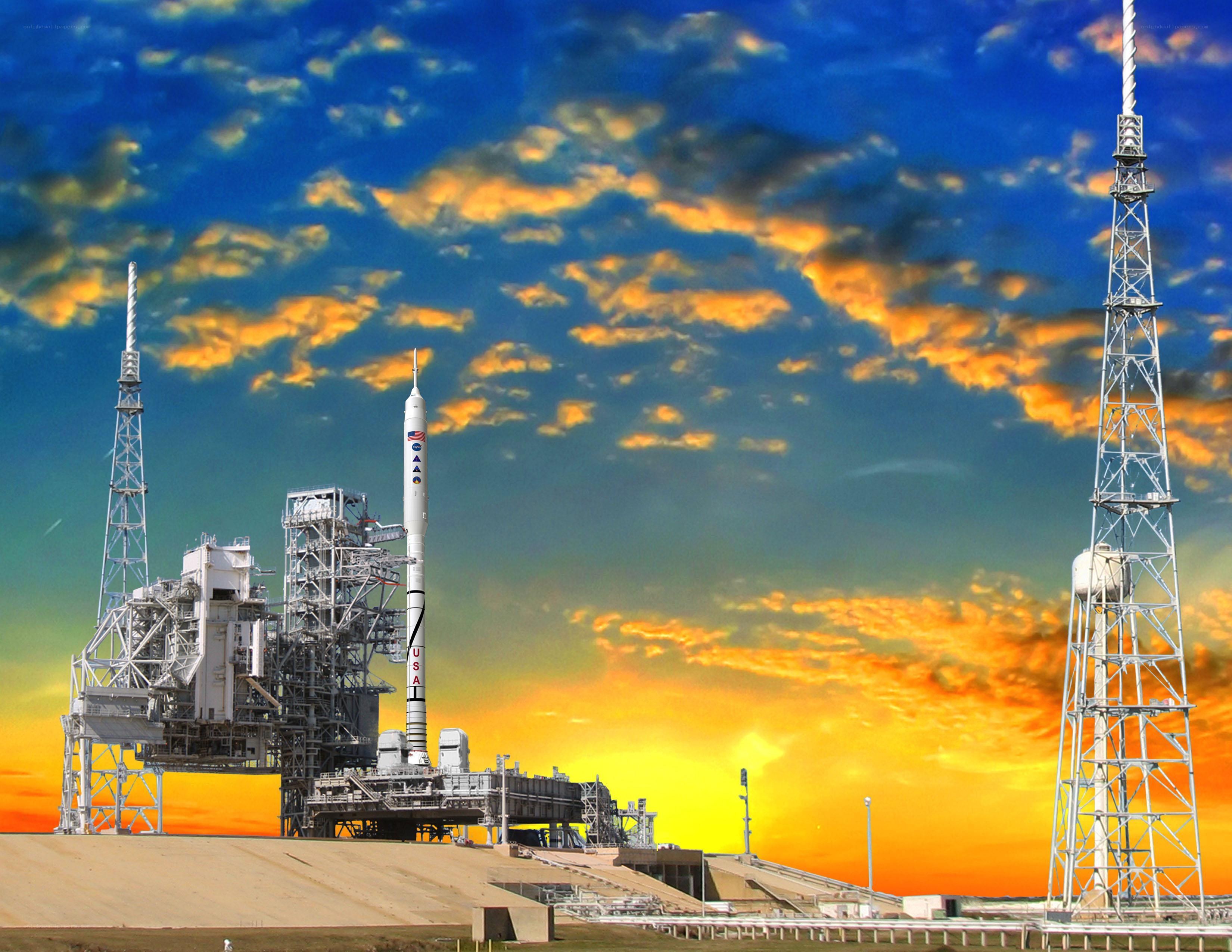 Rocket on launch pad at sunset