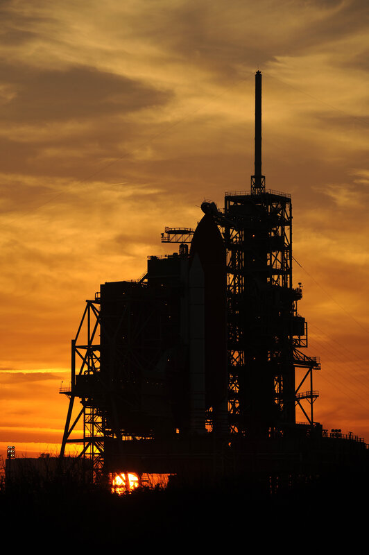Rocket on Launch Pad — Orange, Dramatic