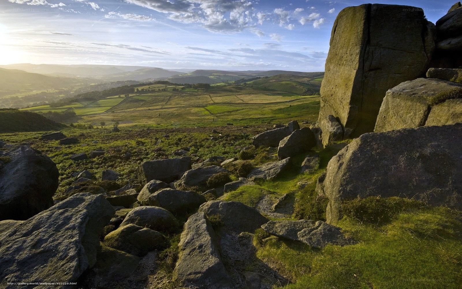 Rocks and rolling hills at sunset