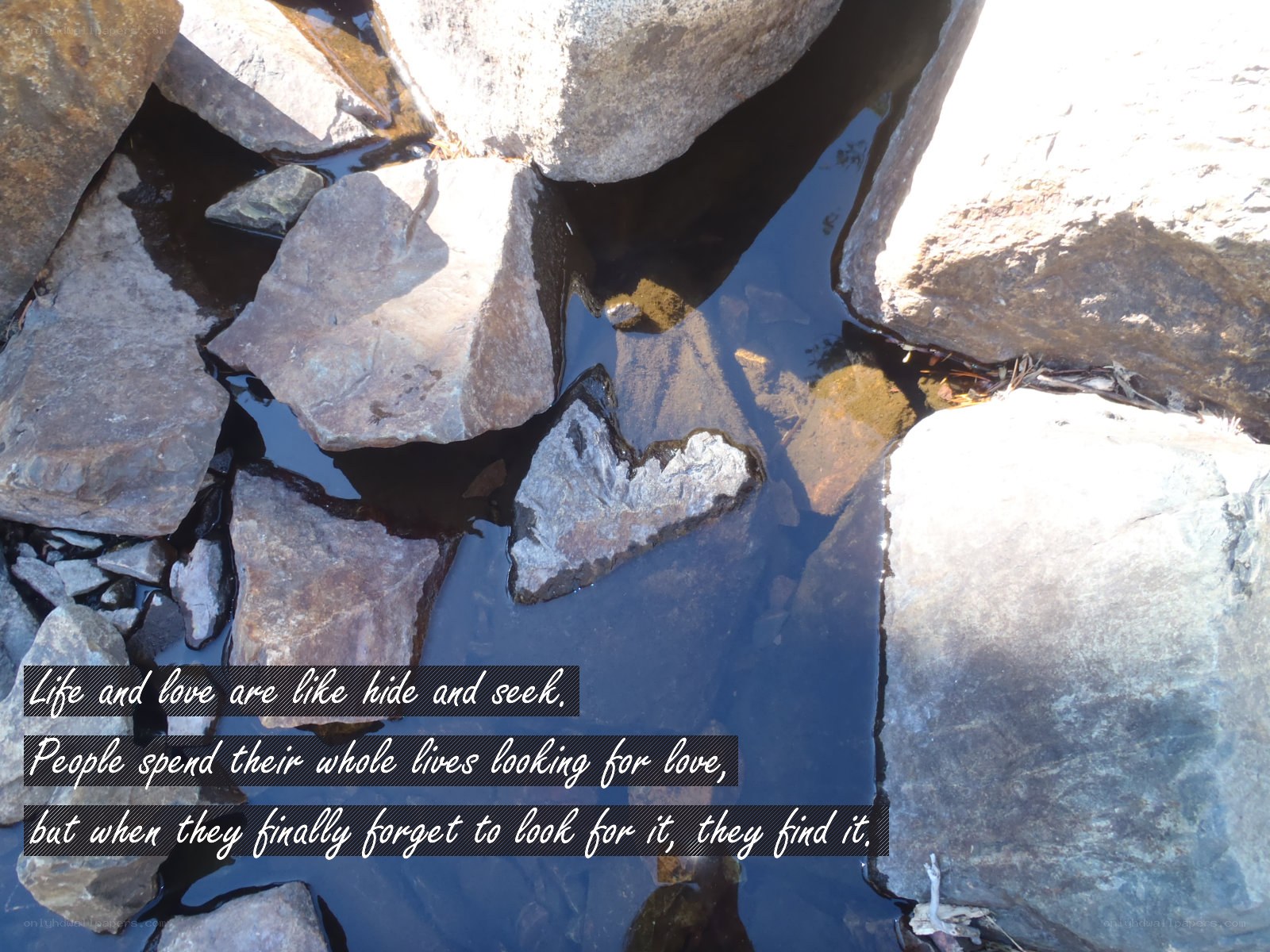 rocks and water with quote